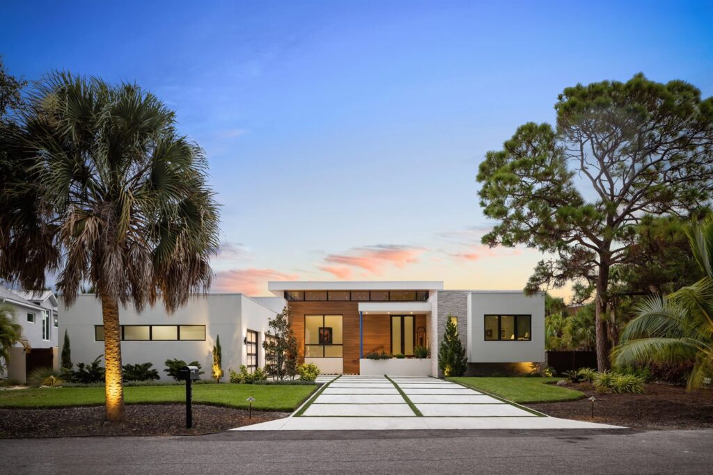 Canal Side Retreat front exterior illuminated at twilight