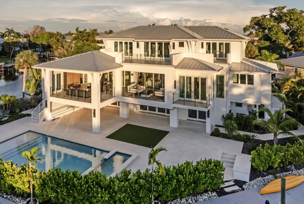 The Boca Pearl waterfront residence and pool viewed at golden hour